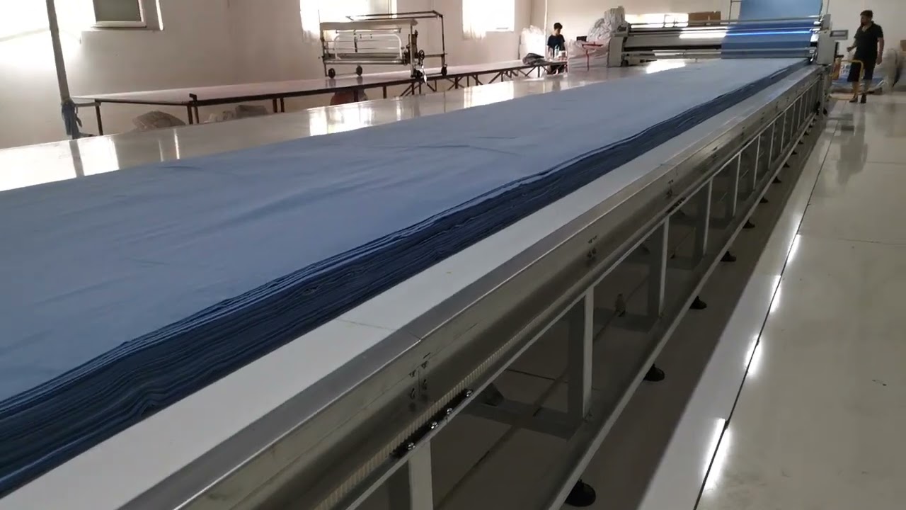 Factory worker at the fabric-cutting station